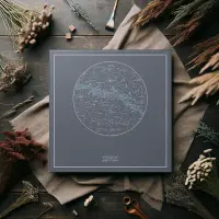 Woman with a dog and a starrymaps.com print on the wall.